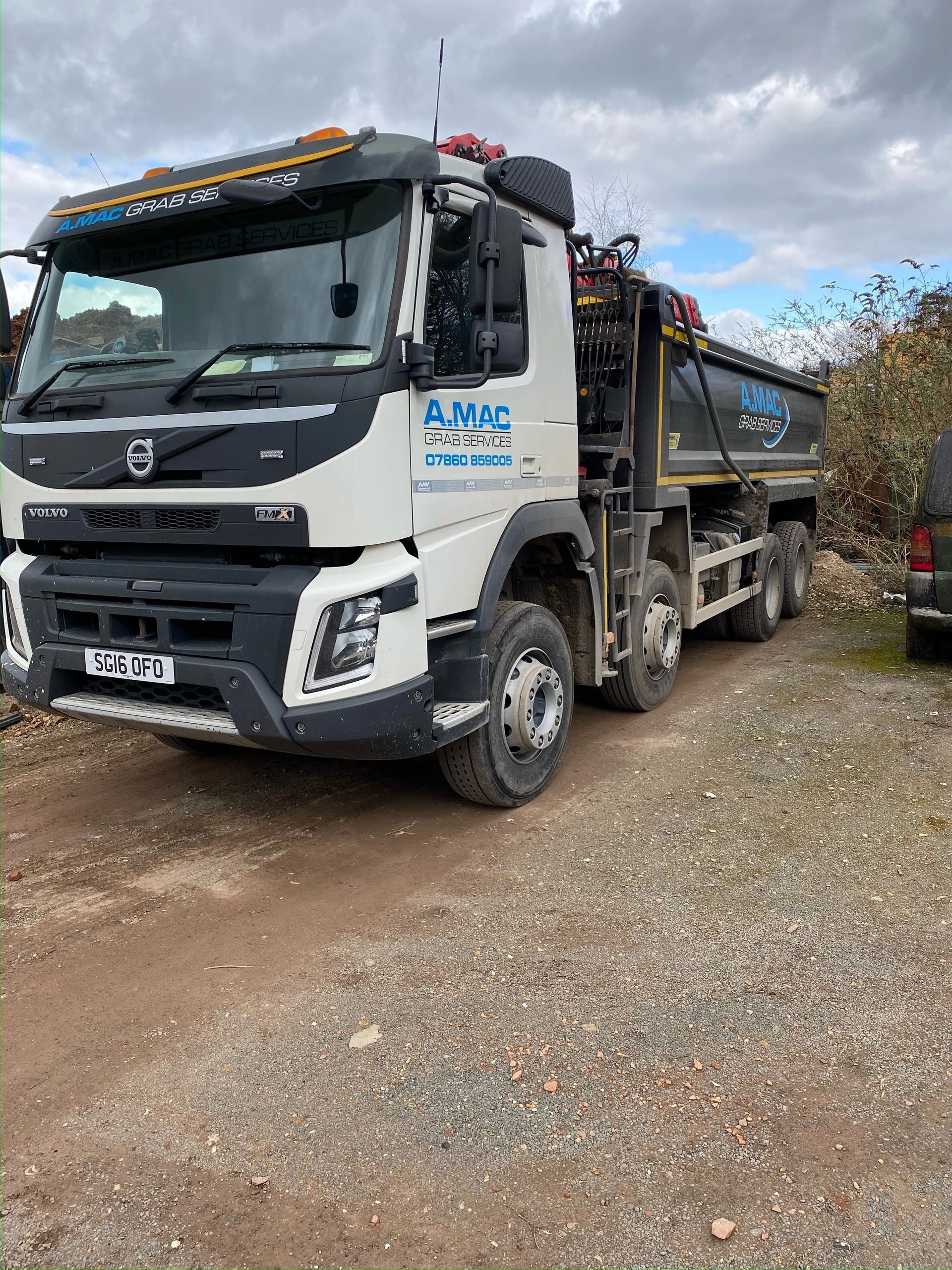 A Mac Grab Hire lorry at work
